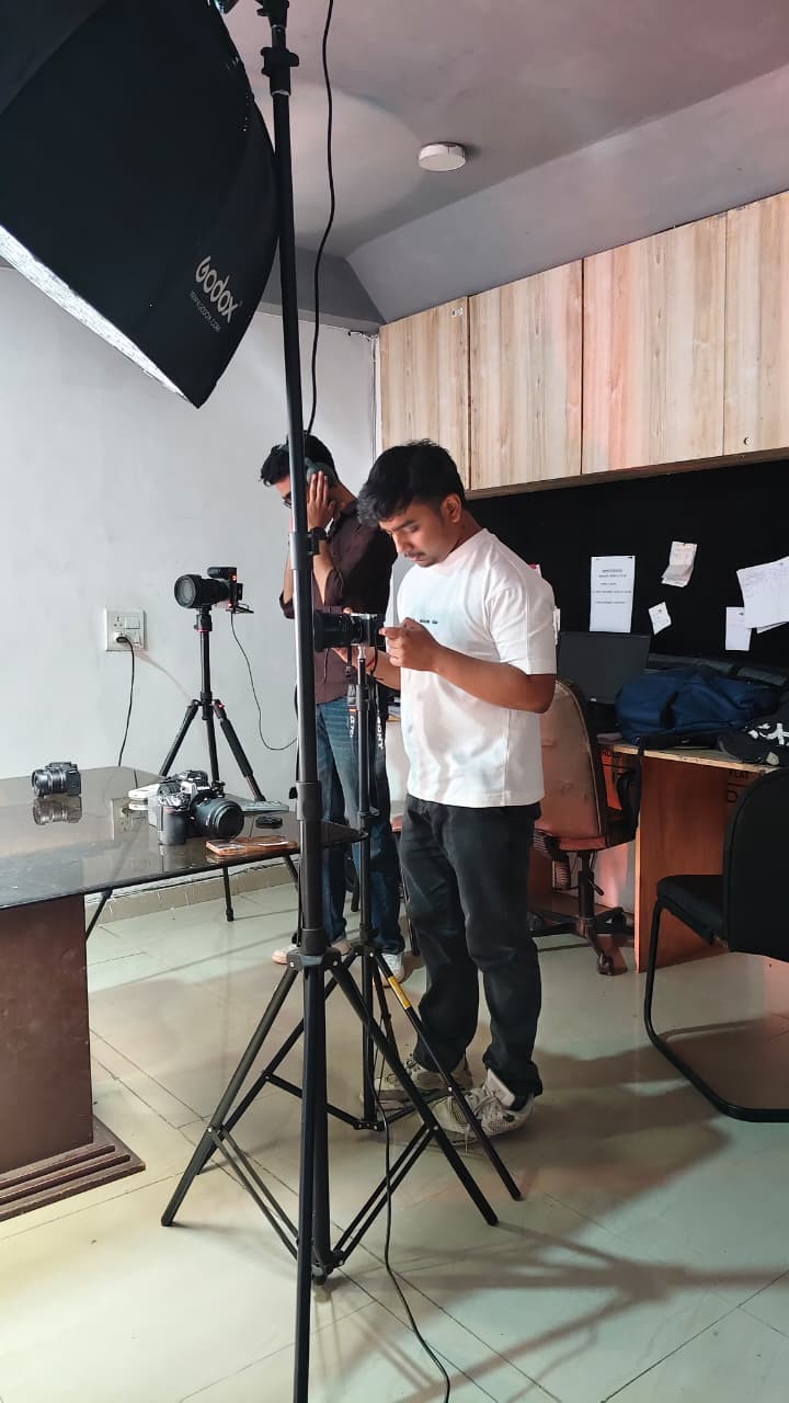 The Multiconn team preparing cameras and lighting for a studio shoot